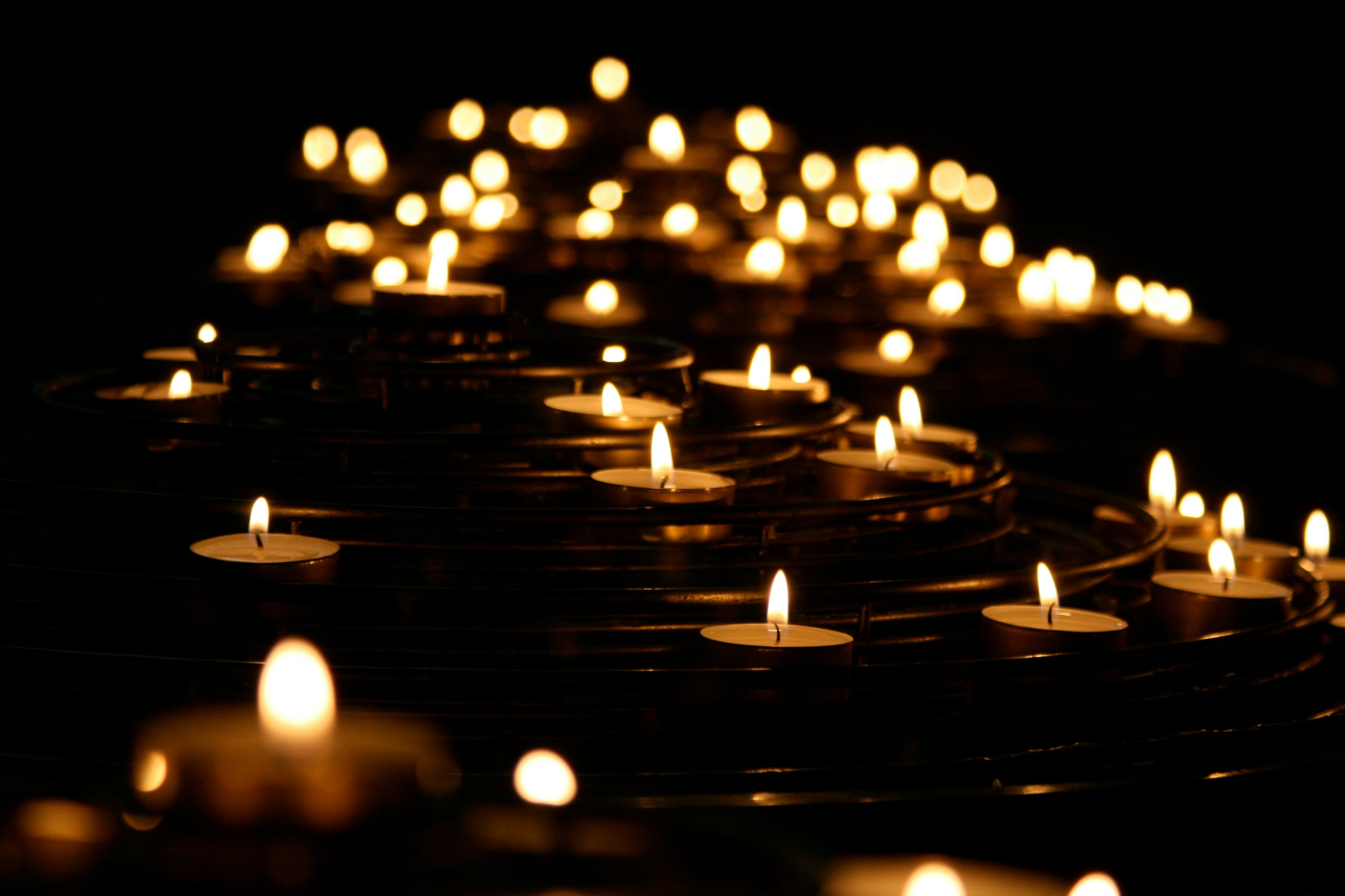  Photo of candles in the dark.Photo by Mike Labrum on Unsplash
